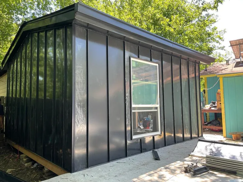 Black standing seam metal wall panels for Roof Inspection in Eden Isle