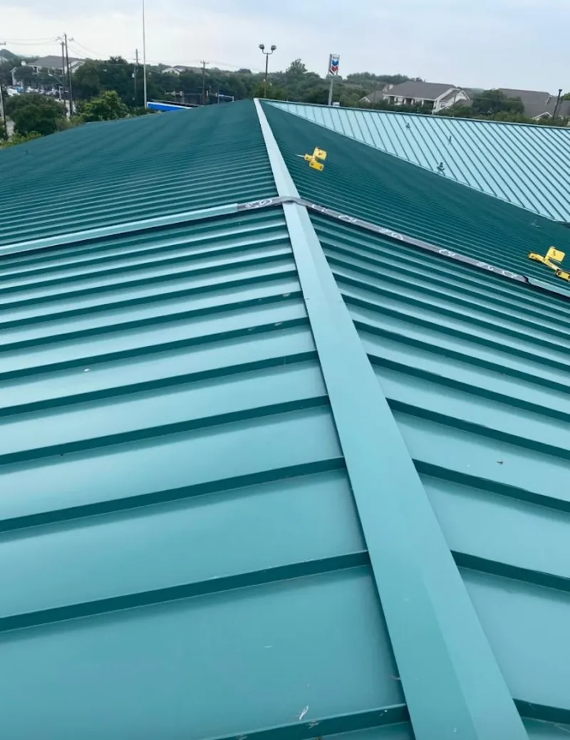 Green commercial metal roof ridge and valley for Metal Roof Repair in Eden Isle